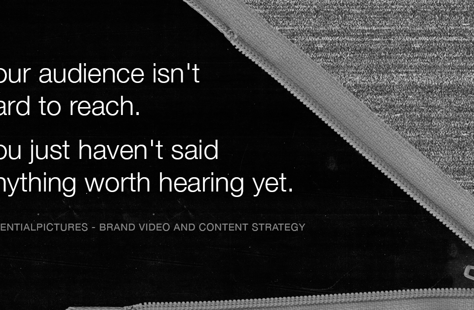 A zipper opening through static noise revealing the words: Your audience isn't hard to reach. You just haven't said anything worth hearing yet.