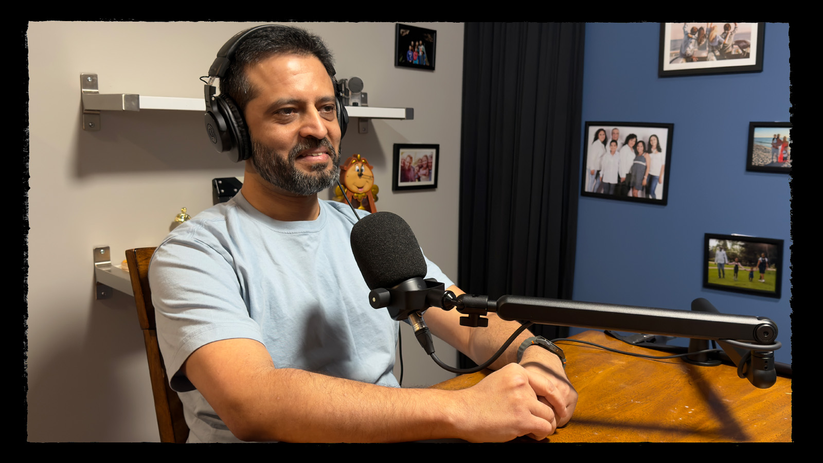 Podcast guest Neel seated at the microphone during an OverArch Podcast recording in the Potential Pictures studio.