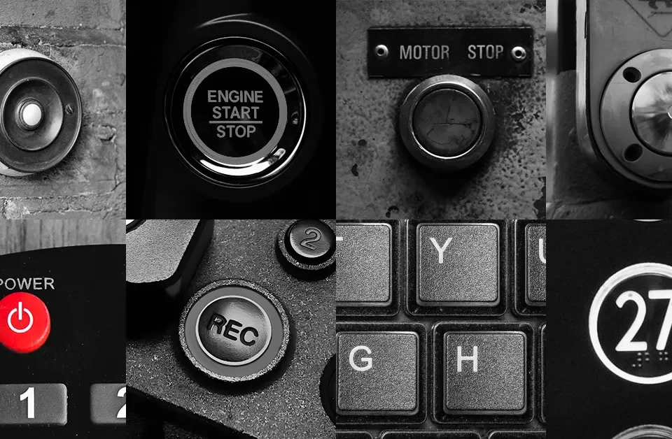 Black and white grid of eight buttons: a doorbell, an engine start button, a motor stop button, a crosswalk button, a red power button, a camera record button, keyboard keys and an elevator button.